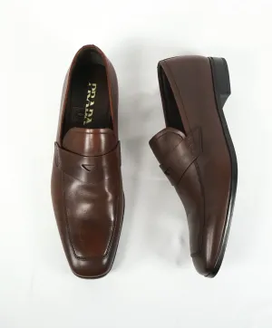 PRADA - Asymmetrical Leather Logo Penny Loafers Brown - 8.5