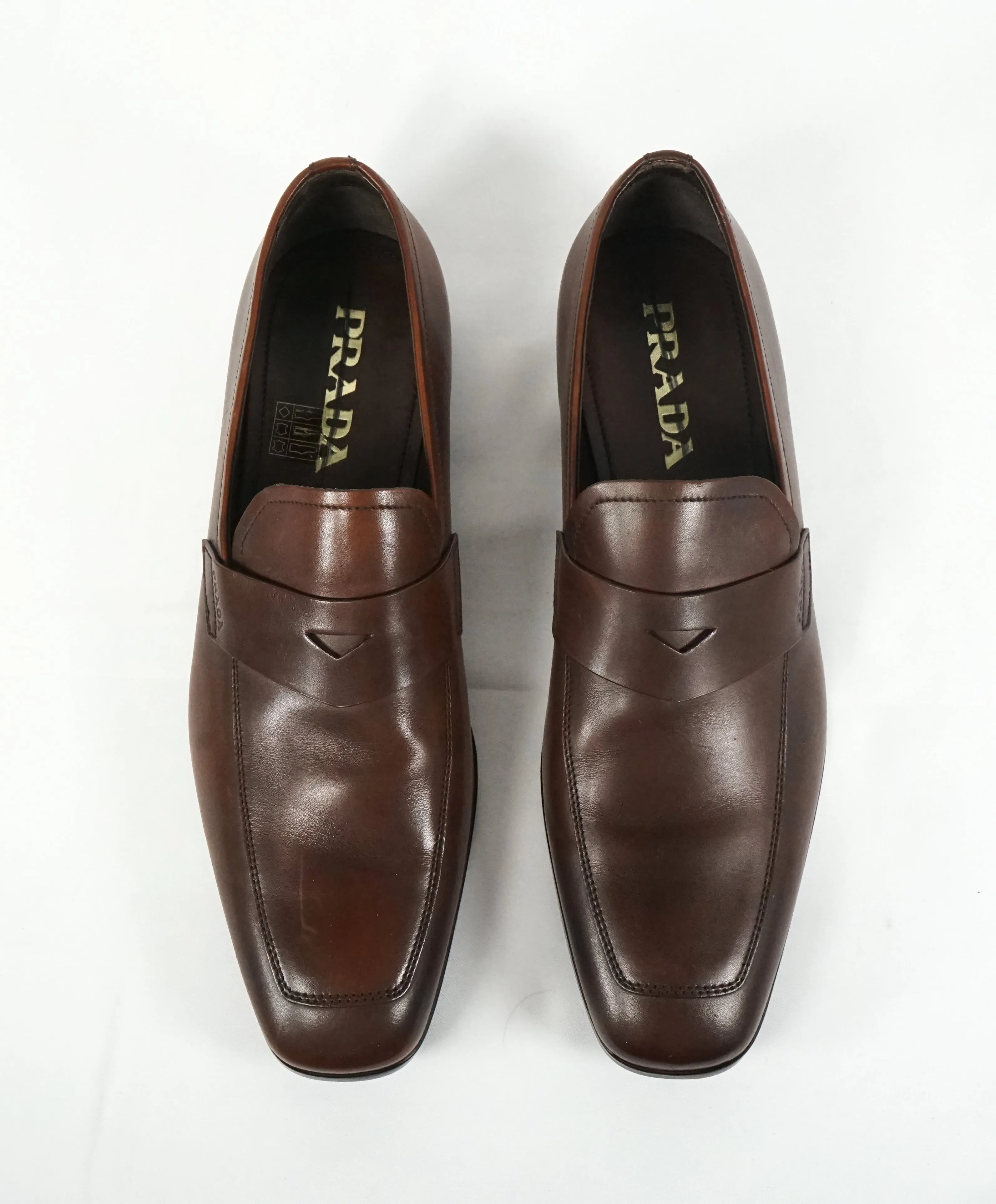 PRADA - Asymmetrical Leather Logo Penny Loafers Brown - 8.5