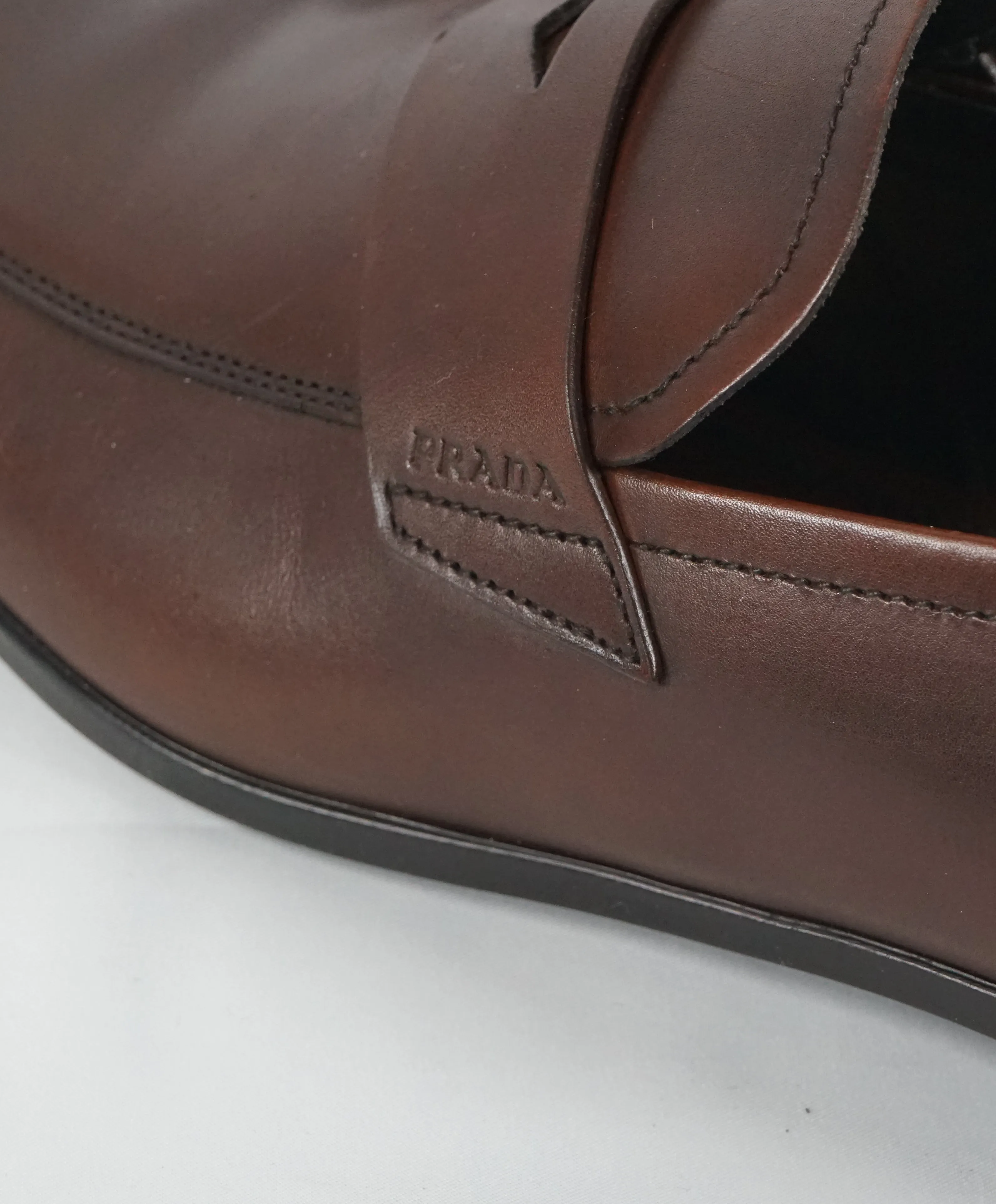 PRADA - Asymmetrical Leather Logo Penny Loafers Brown - 8.5