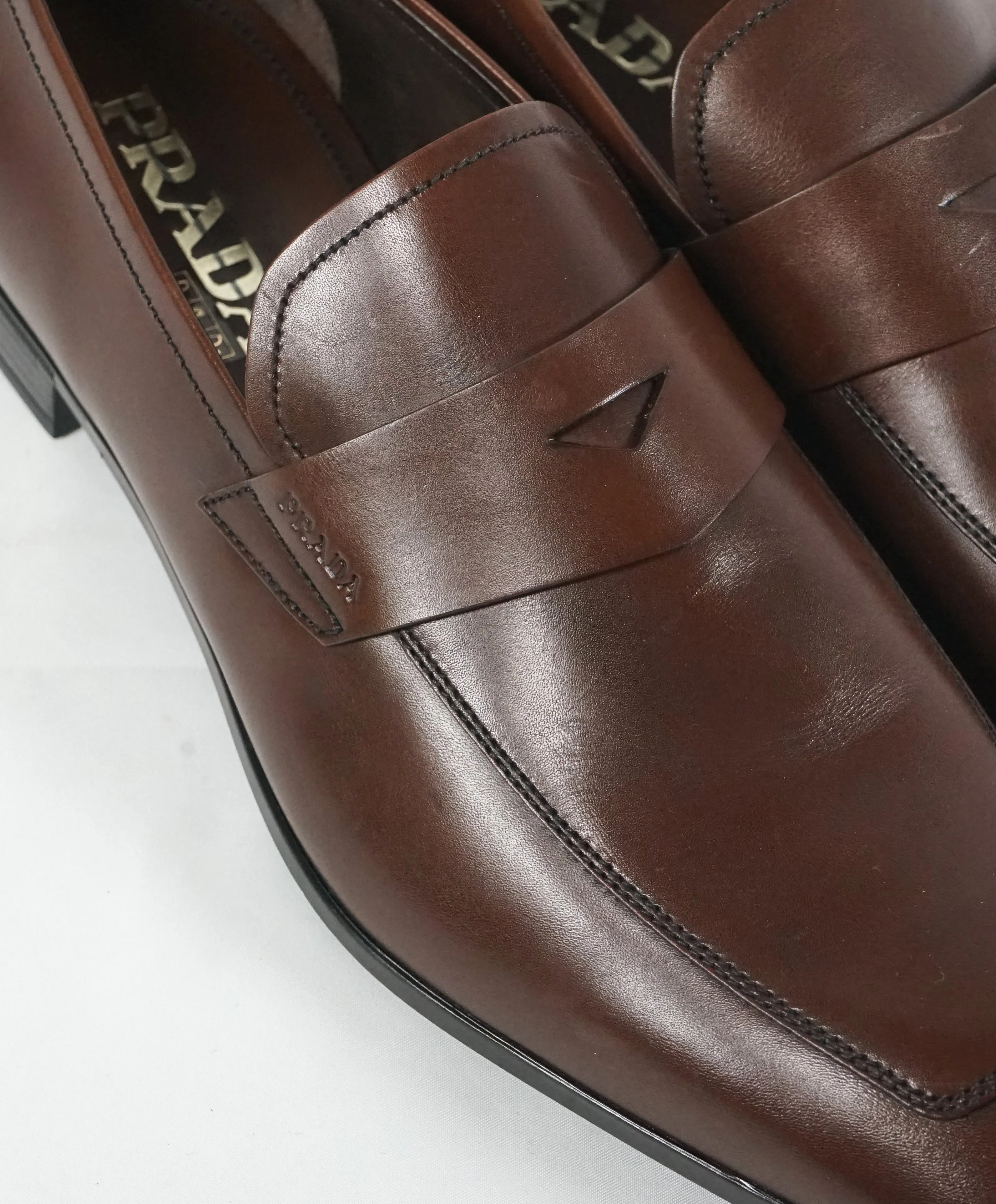 PRADA - Asymmetrical Leather Logo Penny Loafers Brown - 9